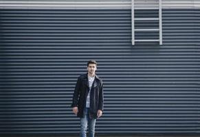 handsome young man in urban setting photo