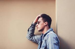 Stylish young handsome man in a denim suit photo