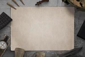 Blank military map on desk surrounded by army equipment photo