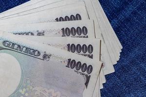 Japanese money, Japan Banknote, yen on Jean Background. photo
