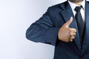 thumbs up from businessman photo