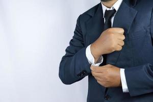 Businessman is fixing his shirt photo