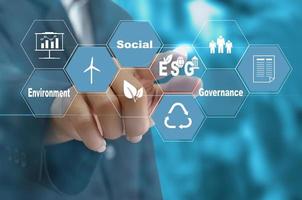 Sustainable business concept EnvironmentalSocial Governance ESG.Hand touching icon business virtual on screen.