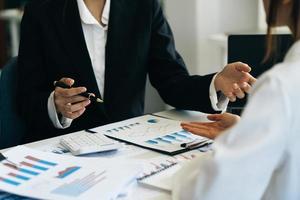 Businessman discussing new project or online data,Strategy Department in corporate brainstorming at meeting room.Business meeting concept. photo