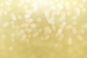Abstract golden bokeh lights effect, soft blurred background photo