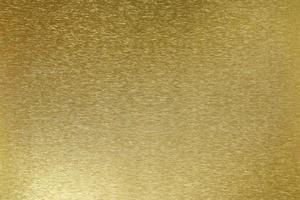 Gold metallic wall with scratched surface, abstract texture background photo