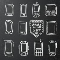 Hand drawn set of mobile gadgets on black chalk board. vector