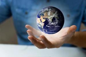 Earth in hands, Man holding blue earth, Save earth concepts. Elements of this image furnished by NASA