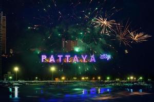 Colorful fireworks on Pattaya city alphabet in the night scene photo