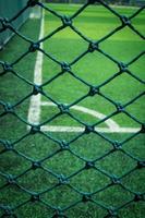 Net in front of artificial turf of Soccer football field. photo