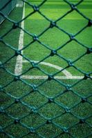 Net in front of artificial turf of Soccer football field. photo