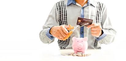 Man using scissors to cut credit card. Concept money, saving, Financial stability, Stop luxury, Create investment opportunity, Start a new business, Bankruptcy protection. Selective focus, copy space photo