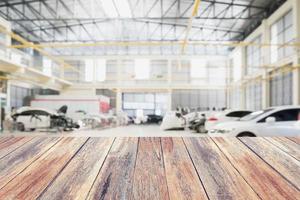 Wood table with Car repair service centre photo