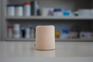 medical elastic bandage with blur shelves of drugstore photo