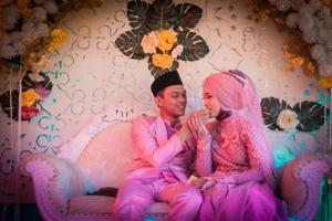 Cianjur Regency, West Java, Indonesia on June 12, 2021, A pair of lovers stare at each other about to kiss. photo