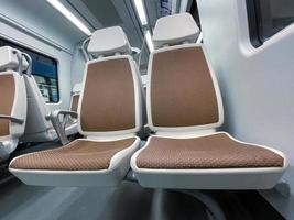 empty seats in the train car, mode of transportation photo