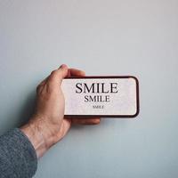 word smile on the smartphone, feelings and emotions photo