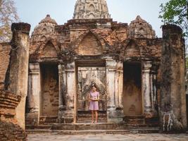 Woman and old temple photo