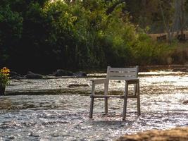 white chair on river photo