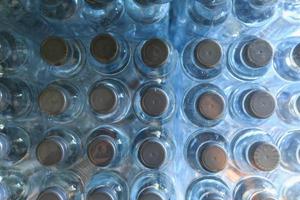 top view of Plastic water bottles packed in packs photo