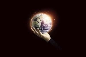 Hand holding planet for earth day and saving energy environment concept ,Element of this image from NASA and 3d render. photo