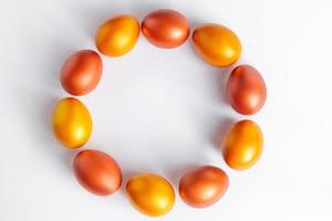 Pattern of golden eggs on white background. Happy Easter. photo