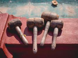 wooden hammer on red cement photo