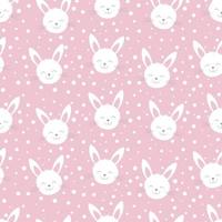 Cute rabbit heads on pink background. Seamless funny pattern vector