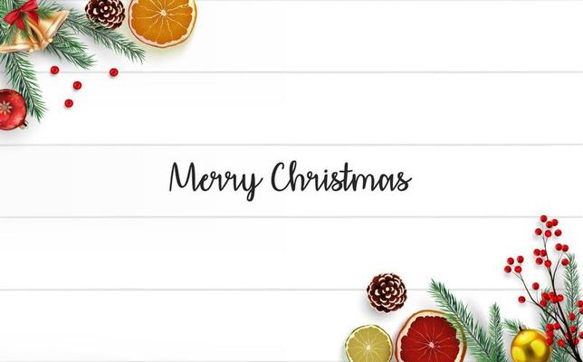 Christmas wooden background with fir branches and golden bells