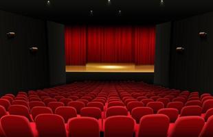 Theater stage with red curtains and seats