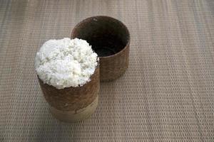 rattan box with hot sticky rice photo