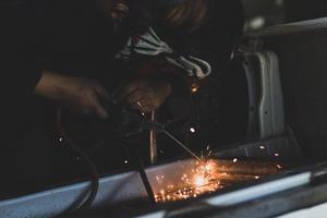 welder, welding automotive part in a car factory photo