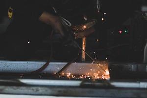 welder, welding automotive part in a car factory photo