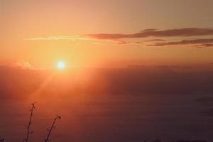 colorful sky with sun in clouds of altitude photo