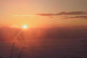 colorful sky with sun in clouds of altitude photo