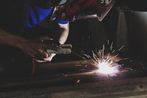 welder, welding automotive part in a car factory photo