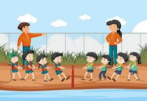 Children playing tug of war game vector