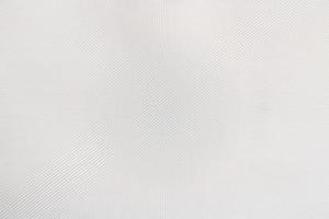 textura de plástico blanco con piezas pequeñas de escamas de material, fondo de patrón abstracto, enfoque selectivo foto