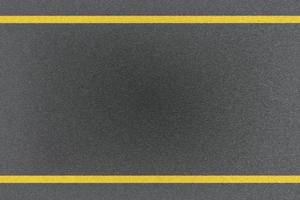 Top view of traffic yellow line marking on metal platform, abstract background photo