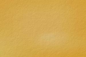 Yellow gypsum wall texture, abstract background photo