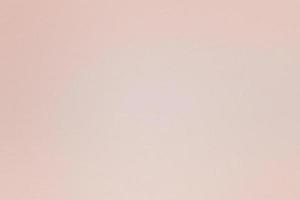 Texture of light pink paper board, abstract background photo