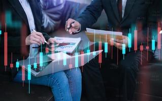 Two stock traiders making analysis of digital market and investment in block chain crypto currency. Stock trade concept photo