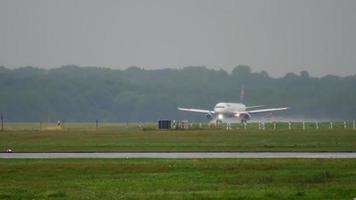 Airplane landing at rainy weather video