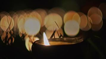 candles in religious ceremony , windy