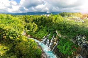 Shirahige waterfall biei river in summer. Famous destination in Hokkaido, Japan. photo
