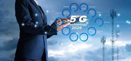 Businessman touching tablet and icon business is growing and make money from 5G technology in 2026. Future and trend marketing. innovative technology and communication network connection. photo