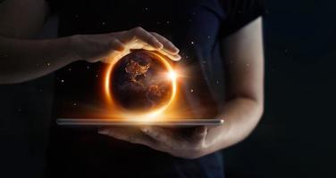 Earth at night was holding in human hands and technology. Earth day. Energy saving concept, Elements of this image furnished by NASA photo
