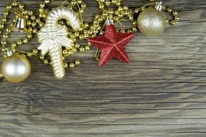 Christmas decorations on old wooden background. photo