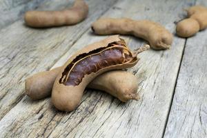 tamarind on grunge wooden background photo