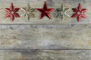 Christmas decorations on old wooden background. photo